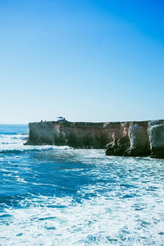Dramatic coastal cliffs overlooking the vast blue ocean in Baja California, Mexico.