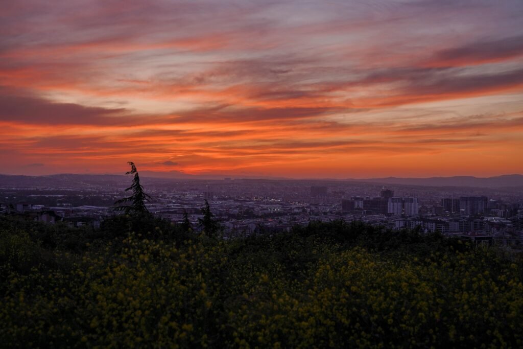 A breathtaking sunset over the city of Bursa, Türkiye, with vivid colors lighting up the sky.